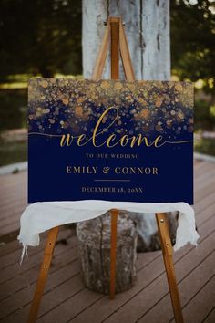 an easel with a sign that says welcome to our wedding