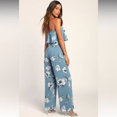 Never Worn But Removed Tags. You'll Look Absolutely Lovely At Any Event With The Lulus Finest Florals Slate Blue Floral Print Strapless Jumpsuit! Lightweight Woven Chiffon, Decorated With An Elegant Blue And White Floral Pattern Throughout, Shapes A Strapless Neckline (With Hidden No-Slip Strips) And Ruffled Flounce Bodice. A Fitted Waist Tops Flowy, Wide-Leg Pants. Hidden Back Zipper/Clasp. Casual Blue Strapless Jumpsuits And Rompers, Blue Strapless Jumpsuit For Spring Day Out, Blue Floral Print Jumpsuits And Rompers For Day Out, Blue Floral Print Jumpsuits And Rompers For Party, Blue Strapless Sleeveless Jumpsuit For Vacation, Blue Strapless Jumpsuit For Summer, Blue Strapless Jumpsuit For Vacation, Blue Strapless Jumpsuit For Summer Day Out, Blue Strapless Jumpsuit For Spring Party