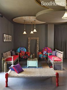 a living room filled with lots of colorful furniture