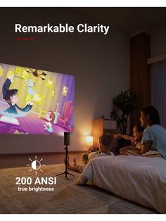 a woman and two children sitting on a bed in front of a flat screen tv