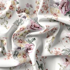 a white fabric with pink and yellow flowers on it