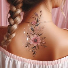 the back of a woman's neck with flowers painted on it