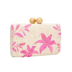 The Sierra clutch, a signiture hand embroidered floral clutch, perfect for an evening out by the oceanside. The raffia fiber is one of a kind, durable quality that will last you a lifetime. Handwoven raffia is paired with wooden ball clasps. Fully lined with an optional chain shoulder strap. Measures 7.75” W x 4.5” H x 2.25” D. Chic Embroidered Summer Clutch, Embroidered Clutch For Evening In Summer, Rectangular Pink Clutch For Vacation, Pink Rectangular Clutch For Vacation, Clutch Pink, Floral Clutches, Straw Clutch, Pink Clutch, Local Artisans