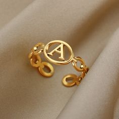 This beautiful and unique YourLetter Hollow Loop Ring is the ideal accessory to stand out in a crowd. Crafted from stainless steel, you have a choice of gold and silver color choices. You can customize your own letter from A to Z, along with a hollow circle with the letter inside. It is easily adjustable and resizeable. Silver Initial Ring, Letter Rings, Gold Color Ring, Letter Ring, Purple Necklace, Stylish Rings, Initial Ring, Men's Jewelry Rings, Christmas Gift Jewelry