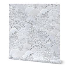 a white wallpaper with an intricate design on it's side, in the shape of waves