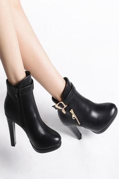 Want to find a fashionable, beautiful, and elegant pair of boots that will match your outfit? Then look no further because the black, round-toe ankle boots with high heels and gold buckle are exactly what you're looking for. The material is made of faux leather and there is a zipper at the side for easy on and off. The heel height is 4 inches, which can make you walk comfortably in any place. The color is black but it has gold details on it that make it pop in any outfit. Our black ankle boots a Chic Ankle Martin Boots For Party, Elegant Black Ankle Martin Boots, Elegant Black High Ankle Martin Boots, Elegant High Ankle Black Martin Boots, Elegant High Ankle Boots With Buckle Closure, Elegant High Ankle Heeled Boots With Buckle Closure, Chic Moto Ankle Boots For Night Out, Chic Ankle Moto Boots For Night Out, Elegant Winter Boots With Metal Feet