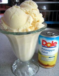 an ice cream sundae next to a can of pineapple juice