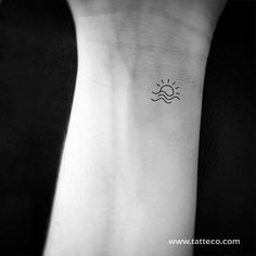 a small sun and wave tattoo on the left wrist is shown in black and white