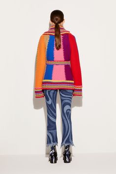 This knitted cardigan captures Pucci's penchant for vibrant hues through its rainbow-style colourblock design. It's crafted from wool to a relaxed silhouette and is finished with an appliqué at the front pocket bearing logo lettering alongside Capri's Faraglioni. Bright red, bright yellow, royal blue, bright pink Shawl lapels Long sleeves Self-tie waist belt Patch side pockets with logo appliqué Striped ribbed-knit trims Relaxed fit 100% wool Dry clean only Style ID: 4UKQ034U963A22 Model is 177cm and wears size XS Made from a midweight fabric Multicolor Knit Color Block Outerwear, Multicolor Wool Long Sleeve Cardigan, Multicolor Wool Knit Sweater, Multicolor Wool Outerwear For Spring, Multicolor Retro Knitted Outerwear, Multicolor Wool Sweater With Patchwork, Multicolor Wool Patchwork Sweater, Multicolor Knit Retro Outerwear, Multicolor Retro Knit Outerwear