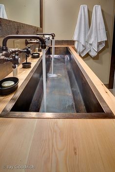 a sink with water running from the faucet