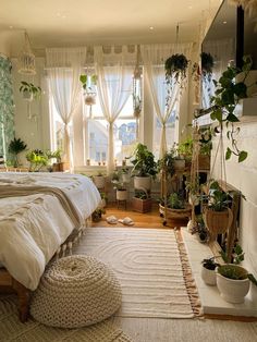 a bed room with a neatly made bed and lots of plants