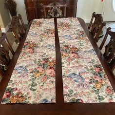 a dining room table with flowers on it