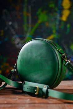 Green leather crossbody bag for women is a sophisticated accessory for everyday use, mini shoulder bag is the perfect size to carry. Circle shape gives this handbag special look. The item is created with attention to the smallest details, its simple and stylish. Our accessories are handmade and unique - one of a kind. ✦ Leather world - Genuine Leather shop Form Grosh Workshop ✦ Leather bags, wallets and accessories - these are tiny list that our workshop offers to you . Round Bags As Gift, Classic Everyday Bag With Round Case, Classic Round Case Bag For Everyday Use, Classic Everyday Bag With Round Case Shape, Round Shoulder Bag For Travel, Leather Bags With Round Handle For Gifts, Chic Round Case Bag For Gift, Leather Round Case Shoulder Bag As Gift, Leather Shoulder Bag With Detachable Strap And Round Case