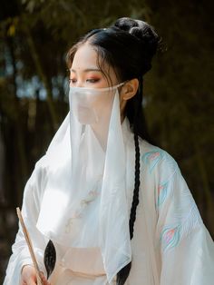 Add a touch of mystery and drama to any hanfu ensemble with these simple veils. Traditionally worn on long journeys, special events, and just for fun! Choose from a variety of colors to best suit your style. Perfect for layering over surgical masks while adding a fantastical touch ~ Material: polyester chiffon Size: 40*60cm About the brand: 绛尾儿 绛尾儿, or Jiang Yi'er is the leading hanfu accessory store for veils and stunning beaded belts. Creating gorgeous accessories for every dynasty, they offer White Hair Color Ideas, Veil Mask, Chinese Headdress, Ancient Chinese Hairstyles, Hanfu Men, East Asian Fashion, Beaded Belts, Simple Veil, White Hair Color