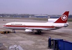 an air canada plane is parked on the tarmac