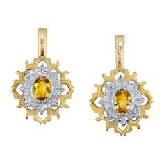 These beautifully original, handmade earrings are a lovely marriage of 18 karat yellow and white gold designed around a striking pair of bright yellow sapphires. Exquisitely engraved and finished, with just enough movement to give you that look of sophisticated style! These are not just "special occasion" earrings; they are a perfect way to add an elegant finishing touch to your daytime wardrobe as well! Handmade in 18 karat white and yellow gold by our Master Jewelers in Los Angeles, the intricate hand engraving and refined finishes are perfect examples of artisan gold smithing at its finest! Yellow sapphires, 7.00 x 5.00mm, 1.88 carat total Pretty Earrings Dangle, Engraved Earrings, Sapphire And Diamond Earrings, White Gold Set, Yellow Gold Earring, Gothic Jewelry, Lovely Jewellery, Yellow Sapphire, Elegant Earrings