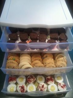 an assortment of cookies and pastries in plastic containers