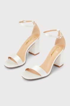 You're certain to step up your style essentials when you add the Lulus Arylee White Satin Ankle Strap Heels to your closet! Sleek satin shapes a single toe strap, an almond-shaped toe bed, and a wrapped block heel. A dainty ankle strap rises from the sturdy heel cup and secures with a gold buckle. 3" Wrapped Block Heel. Cushioned Insole. Felted Rubber Sole Has Nonskid Markings. Man Made Materials. Imported. Lulus | Arylee White Satin Ankle Strap Heels. White Lulus Heels, Homecoming Shoes Ideas, White Prom Shoes High Heels, Wedding Shoes Bride Simple, Quince Shoes Heels White, Cute Shoes With Dresses, Cute Heels White, Wedding Shoes Satin, Cute Shoes For Prom