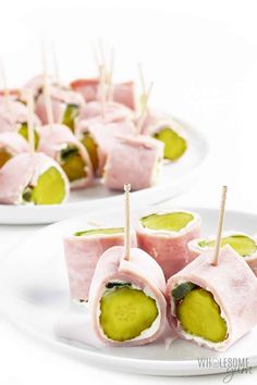 small appetizers with pickles and cheese on them