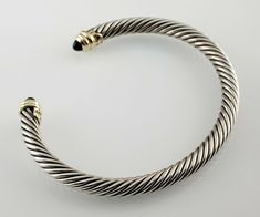 David Yurman Sterling Silver Onyx Cuff Bracelet w/ 14k Yellow Gold Accents #DavidYurman #Cuff David Yurman Mens Ring, David Yurman Cable Bracelet, David Yurman Earrings, David Yurman Necklace, David Yurman Bracelet, Cable Bracelets