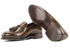 Step into unparalleled sophistication with our Handcrafted Tobacco Patina Loafers, a testament to the timeless elegance of traditional English craftsmanship. Key Features: Materials: Tobacco Patina leather exterior, exuding a rich and distinctive aesthetic. Sole: Brown Goodyear Welt Leather Sole, ensuring durability and a touch of classic charm. Last: Zurigo Last, presenting a rounded toe for that quintessential traditional English look. Artisan-Hand Made Patina: The Anticatura technique, master Timeless Formal Tassel Loafers With Leather Lining, Luxury Italian Tassel Loafers For Formal Occasions, Classic Brown Loafers For Wedding, Designer Tassel Loafers With Leather Sole For Formal Occasions, Designer Tassel Loafers With Leather Sole For Formal Events, Elegant Fitted Leather Tassel Loafers, Classic Brown Wedding Loafers, Elegant Slip-on Tassel Loafers, Timeless Formal Tassel Loafers With Rubber Sole