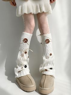 Embrace a blend of style and warmth with our White Knit Leg Warmers with Buttons. Featuring self-tie straps, these leg warmers can be adjusted to your liking. The delicate white color adds a touch of purity and sophistication to any outfit. Adorned with stylish buttons, these leg warmers bring a charming, vintage-inspired look. Garment Size SizeFree SizeFull Length47Cuff22/40 Casual White Leg Warmers For Winter, White Knitted One Size Leg Warmers, White Knitted One-size Leg Warmers, White Knitted Leg Warmers For Fall, Cozy White Leg Warmers For Fall, Cozy White Knitted Leg Warmers, White Knit Leg Warmers One Size, White Knit One Size Leg Warmers, White Knitted Leg Warmers For Spring