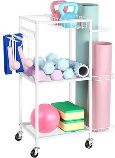 a white shelf with various items on it and some pink, blue, green, yellow