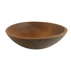 a brown bowl sitting on top of a white wall