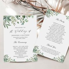 two wedding programs with greenery on them