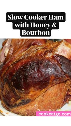 slow cooker ham with honey and bourbon on a white platter, text reads slow cooker ham with honey and bourbon