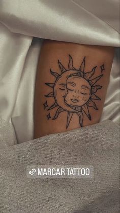 a sun and moon tattoo on the leg