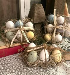 some eggs are sitting in a nest on top of a book and tied with burlap