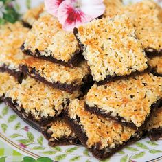 a plate topped with brownies covered in coconut flakes