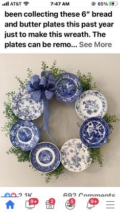 a wreath with blue and white plates on it