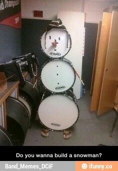 a drum set up in the middle of a room