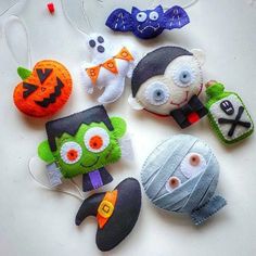 halloween decorations made out of felt on a table