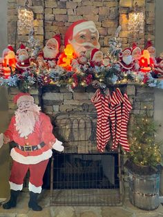 a fireplace decorated with christmas decorations and santa clause