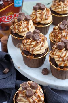 chocolate cupcakes with peanut butter frosting and caramel drizzle on top