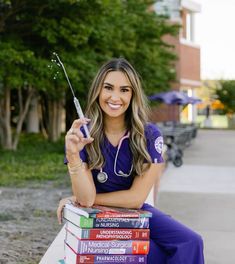 a woman sitting on a bench with books and a syringe in her hand