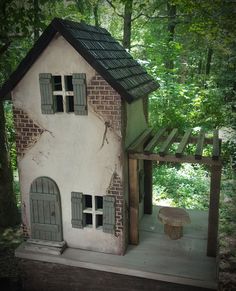 a doll house in the shape of a treehouse