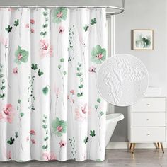 a shower curtain with pink flowers and green leaves on it, next to a white bath tub