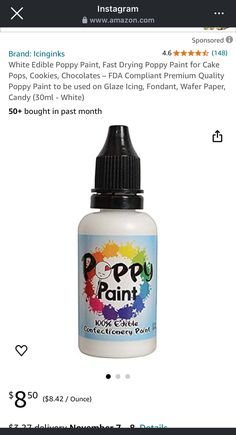 a bottle of white edible paint sitting on top of an amazon listing for the product