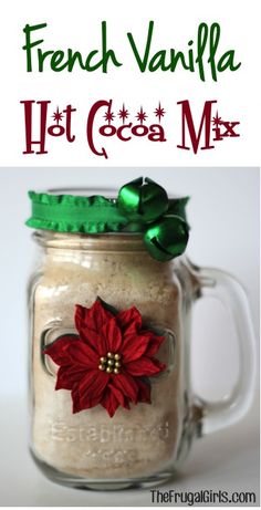 a mason jar filled with hot cocoa mix and decorated with poinsettis on top