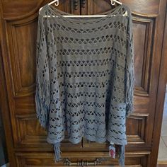 Nwt Poncho Shawl. Gray With Gold Accents. One Size. New With Tag Golden Shinny Accents Fringes One Size 80% Polyester And 20% Viscose My Purchase Price Was $25 No Refunds, No Returns, No Exchanges #Poncho #Shawl #Nwt #Casual #Streetwear #Outdoor #Travel #Vacation #Gray #Gold #Fringes #Gift Brown Tunic, How To Fold Sleeves, Lace Blouse Long Sleeve, Poncho Shawl, Bandana Styles, Poncho Tops, Grey Knit Sweater, Cozy Pullover, Poncho Sweater