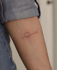 a person with a small tattoo on their arm