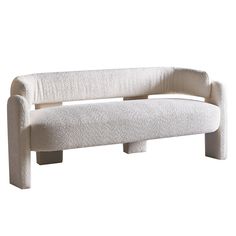 a white couch sitting on top of a wooden frame