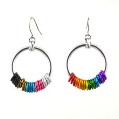 Hoop earrings in the colors of the Progress Pride flag. Choose from mismatched set (with one earring in colors of rainbow pride and the second with the additional colors) or mirror image set (with all colors on each earring).🌈 lightweight & comfortable to wear - each earring weighs about 2 grams (less than the weight of a US dime)🌈 about 1.5" long, including earwire🌈 the colorful links aren't glued down, so you can feel free to fidget with them between your fingertips; they can slide up and d Lgbtq Rainbow, Bright Rainbow, Blue Violet, Rainbow Pride, Mirror Image, Pride Flags, Orange Gold, Lilac, Dangle Drop Earrings