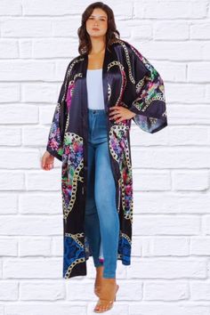 Introducing our FASHION KIMONOS COVER UP - a timeless piece of summer elegance. The black print with cerise pink paisley adds an elegant and chic touch to any outfit. Elevate your style with this exclusive piece. maxi kimonos, long sleevesModel size small 5'9" 32-25-35 Dress 2 Bust 52 inches, Length 55 inches Fabric Contents: 100% POLYESTER