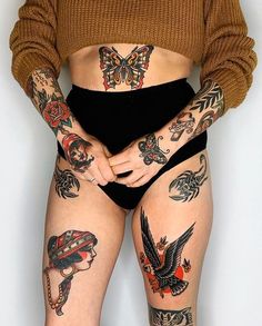 a woman with many tattoos on her body