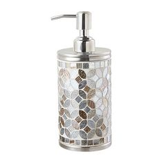 a soap dispenser made out of glass and metal with mosaic tiles on it